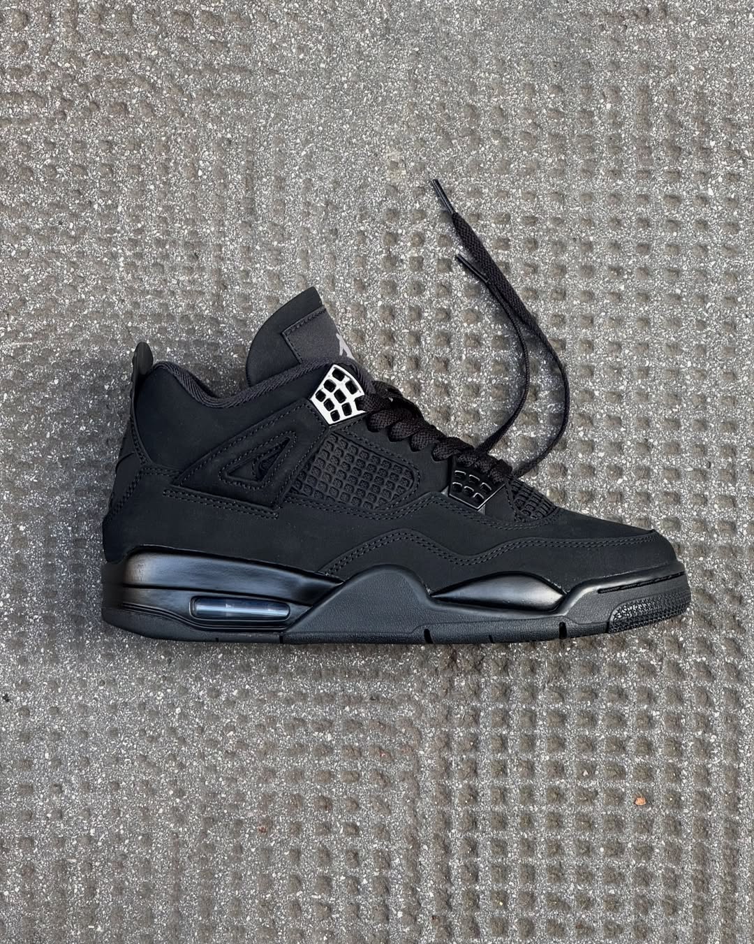 Black Cat, New Night: The Jordan 4 “Black Cat” (2025) and Why Monochrome Never Sleeps